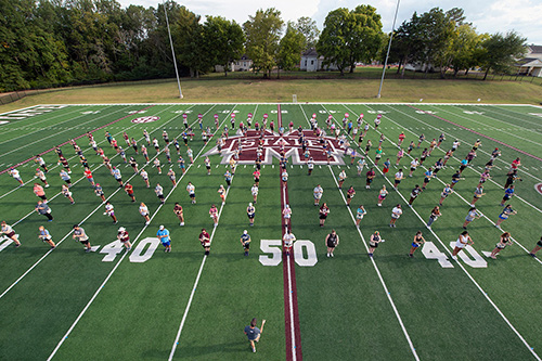 A portion of the Famous Maroon Band practices a choreographed marching routine that will be showcased this year in video format.