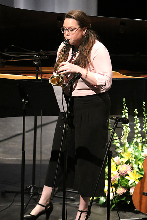 Catherine Patriquin playing a saxophone