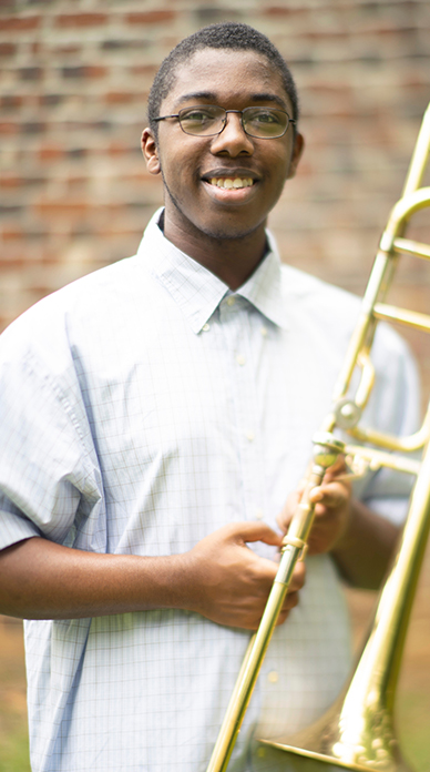 Photo of Deontrae Peyton with his trombone.