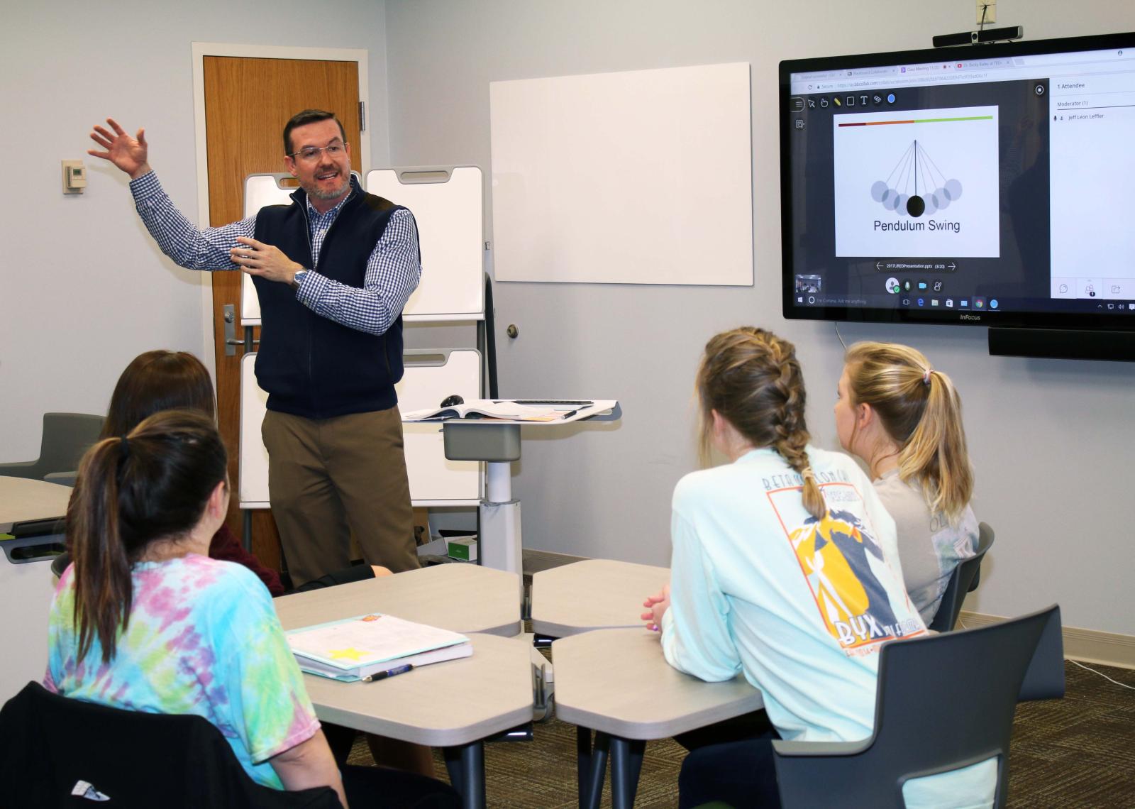 Professor in front of classroom teaching