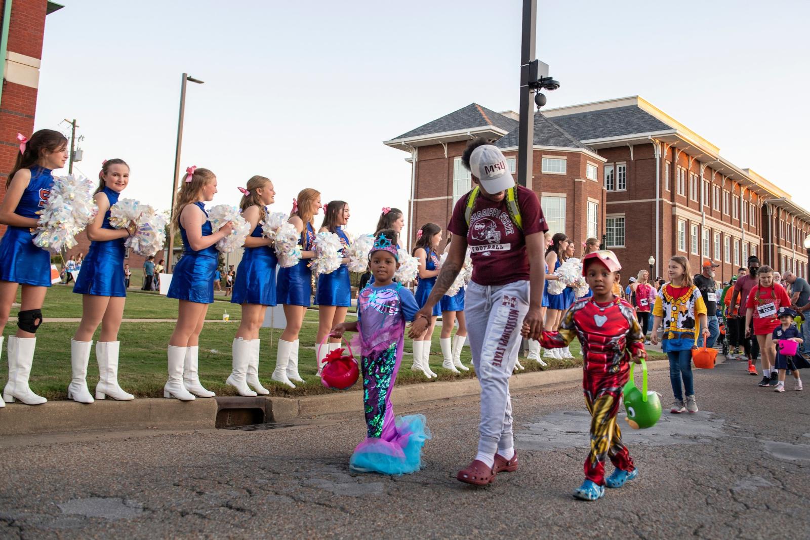 Children and families participate in the T.K. Martin Center's "Trick or Trot" fun run.