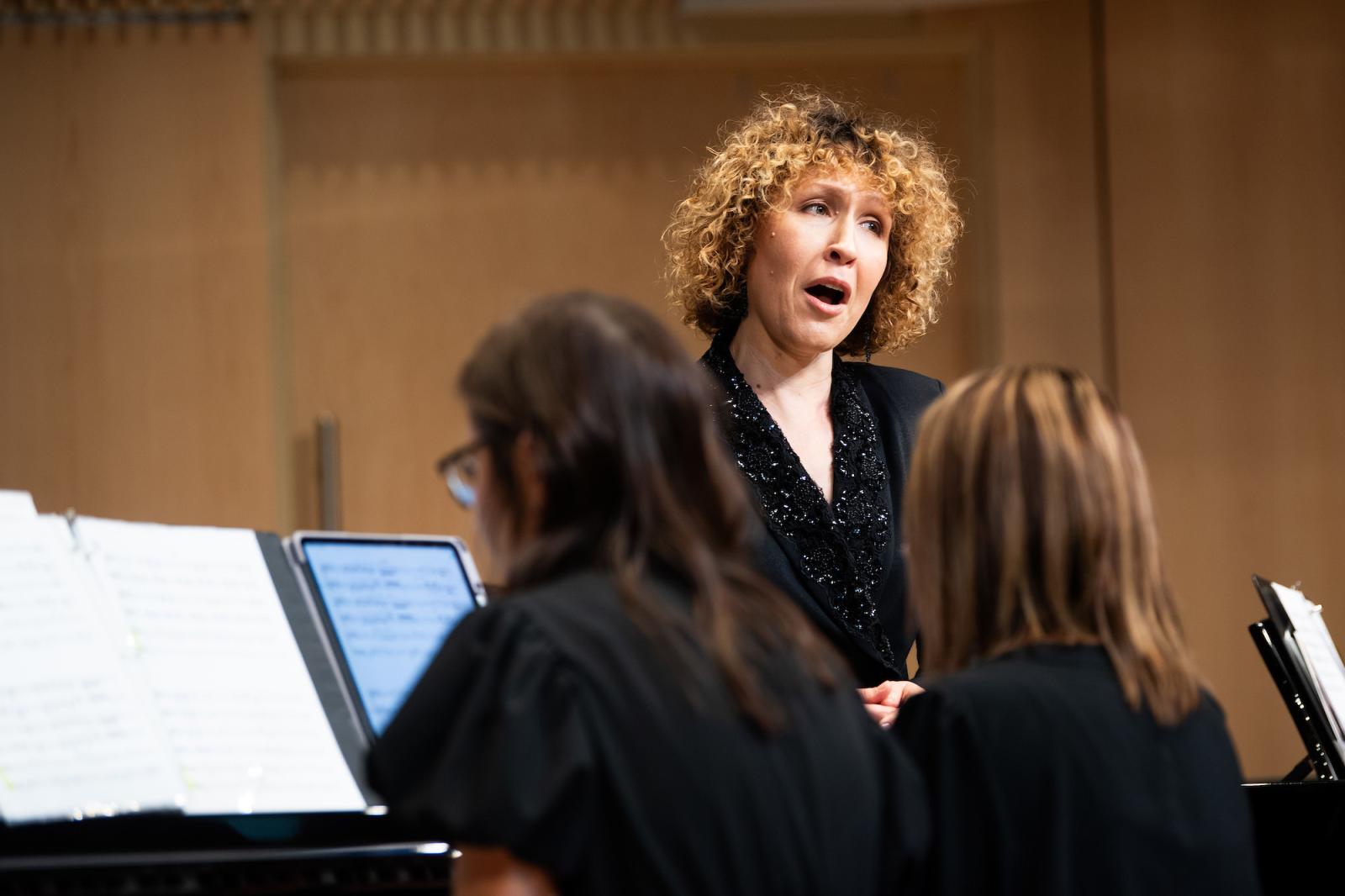 Music faculty member sings during an event