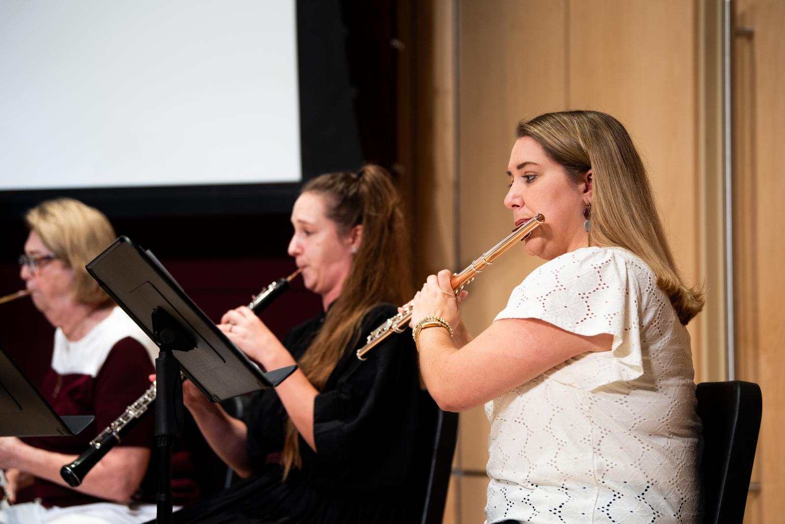 Music faculty play instruments onstage
