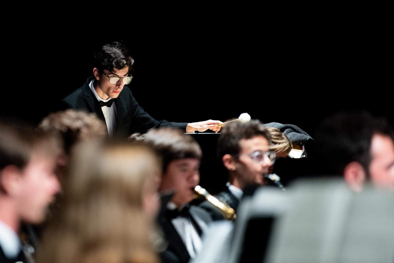 Students playing instruments during performance