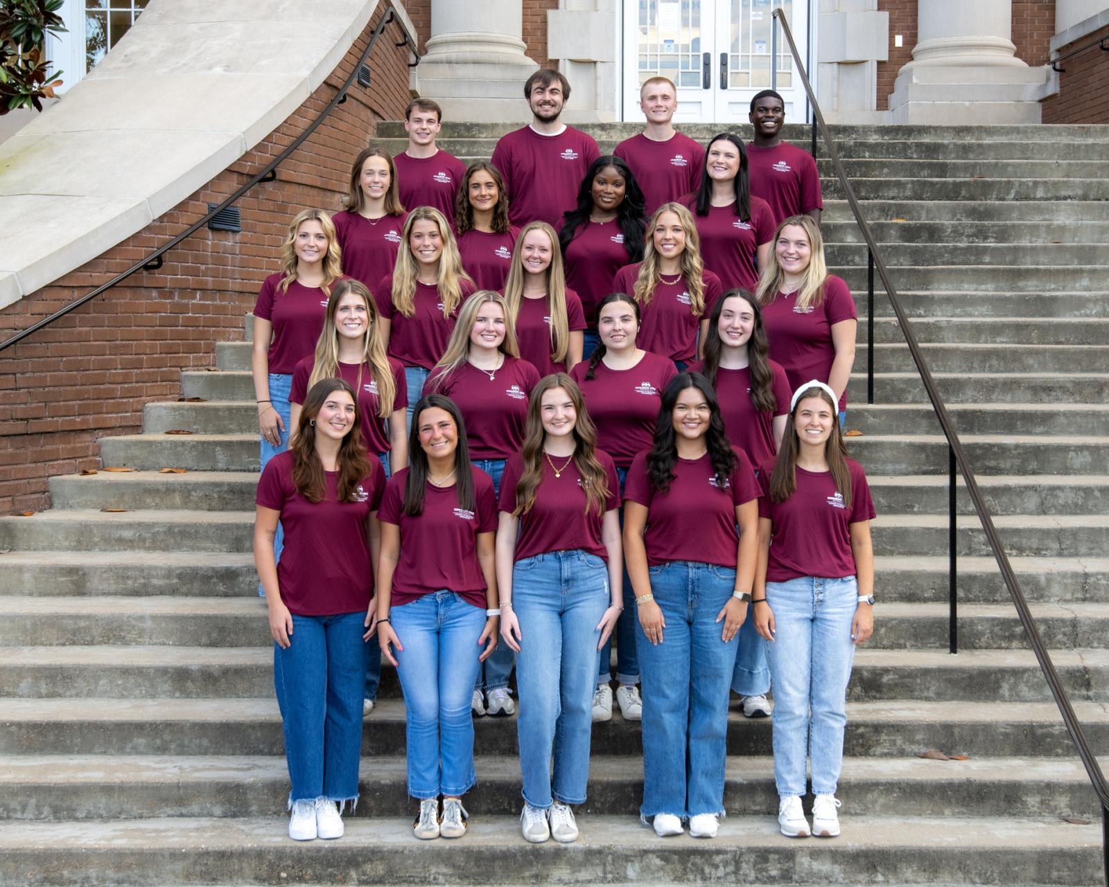 College of Education Ambassadors pose for a photo on steps