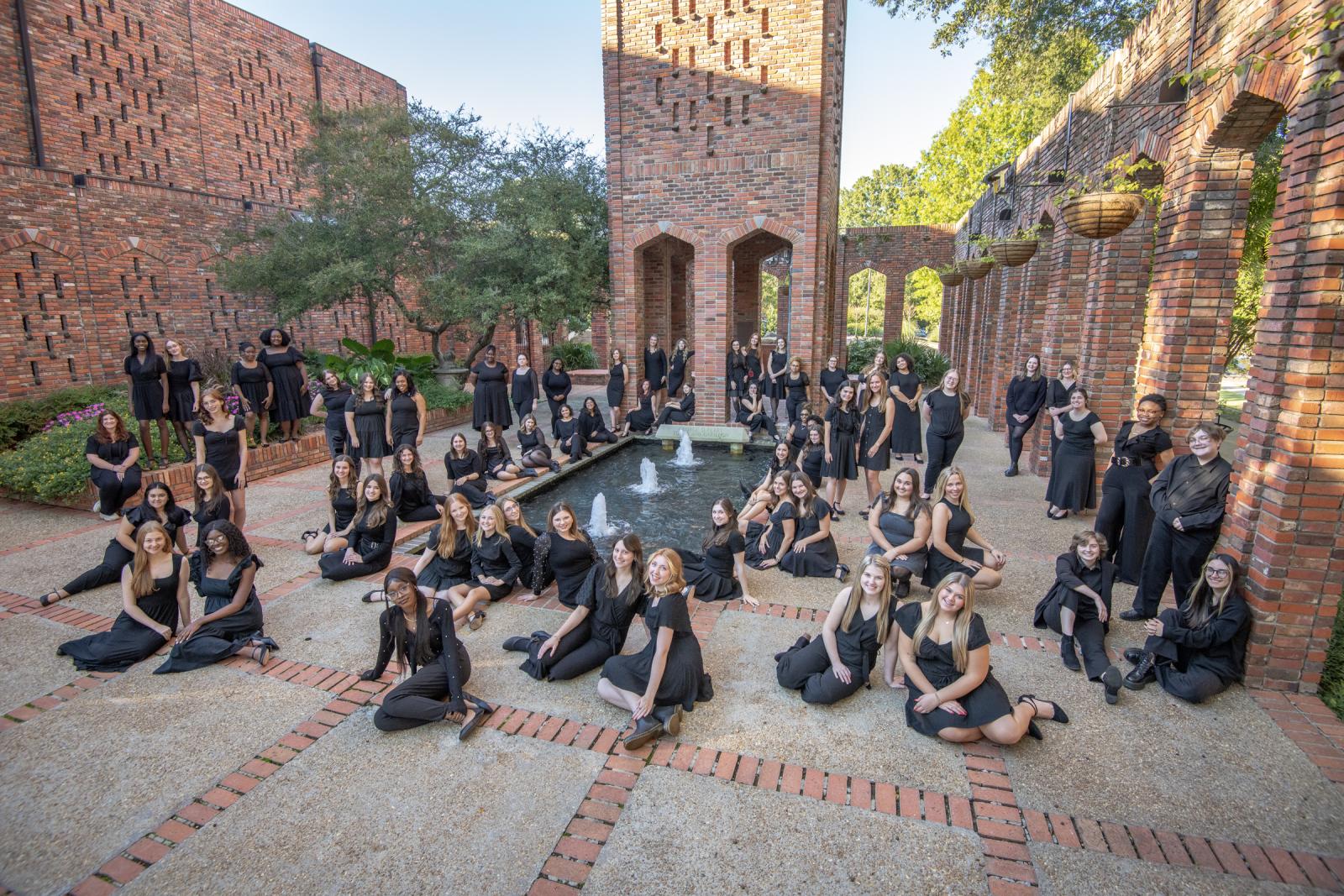 Student ensemble posed around chapel area