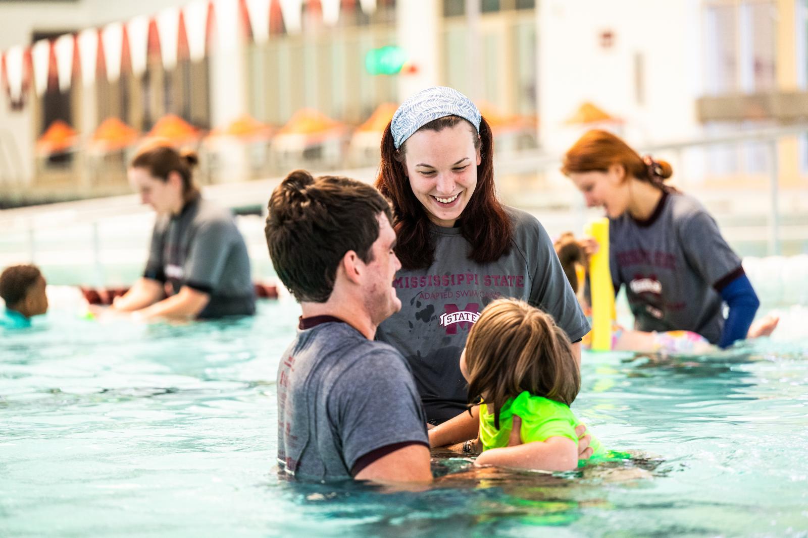 MSU students help children learn to swim in pool