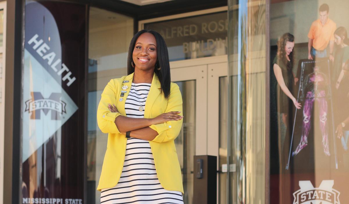 Photo of Ashley White Jones in front of a shop