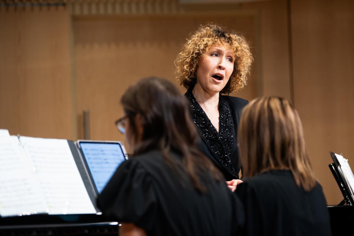 Music faculty member sings during an event