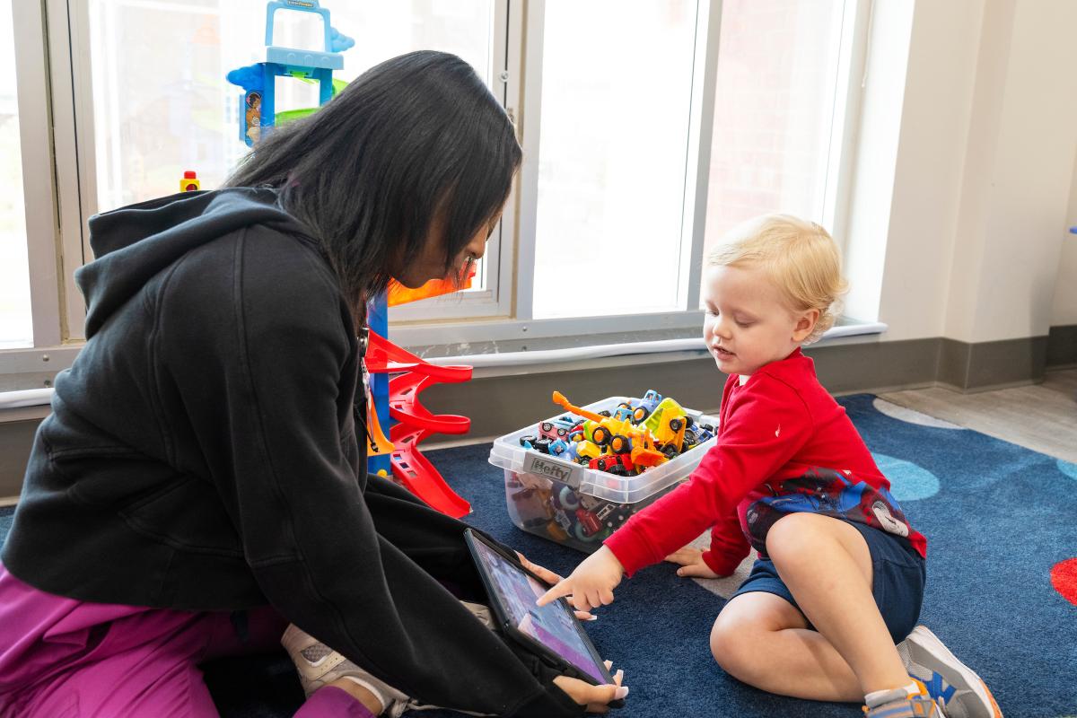 MSU student helps child with device