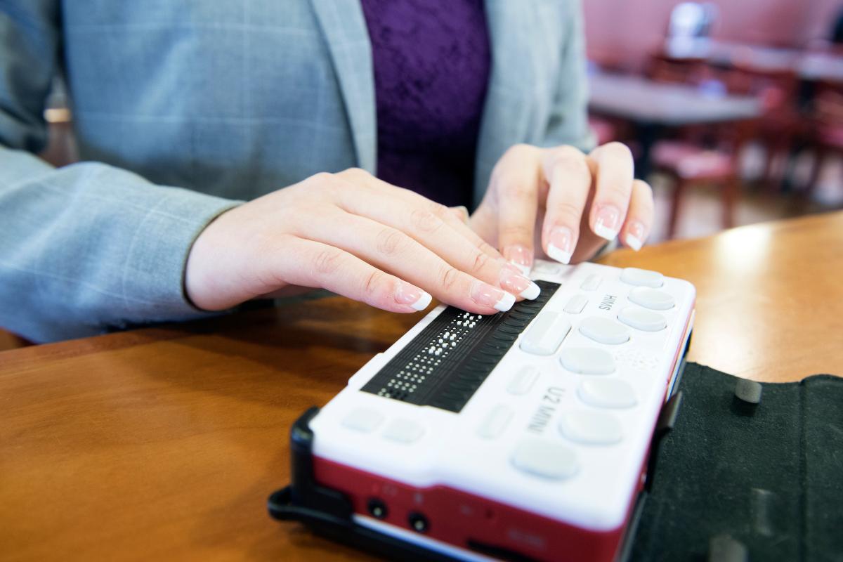 A woman uses assistive technology