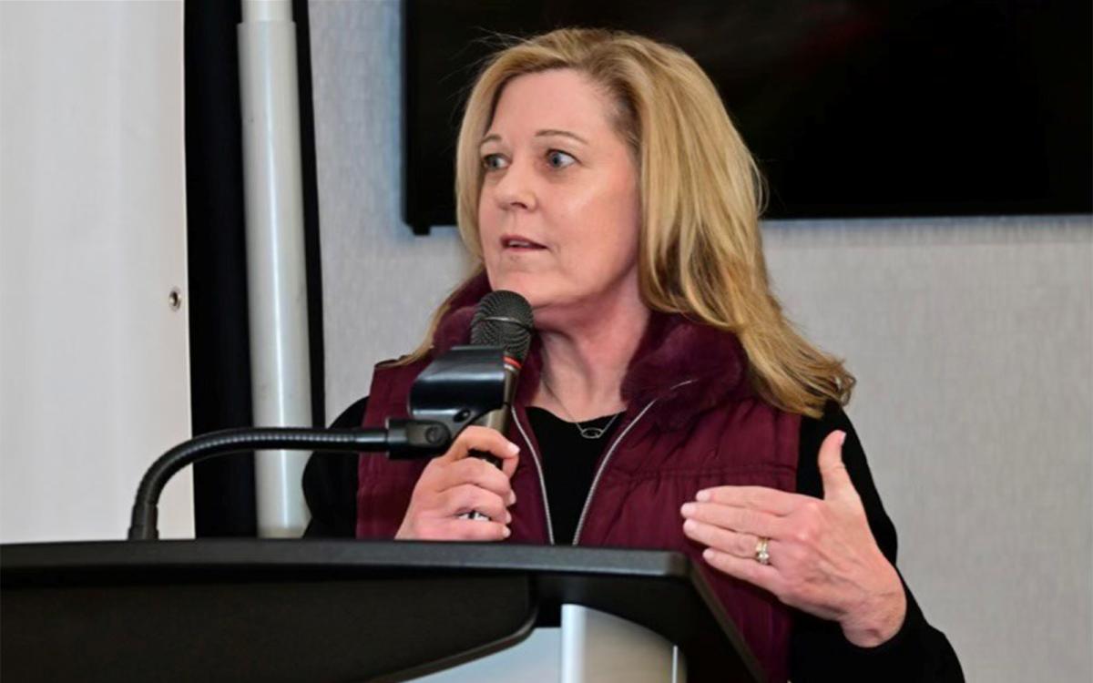 Sheila Williamson speaking into a microphone