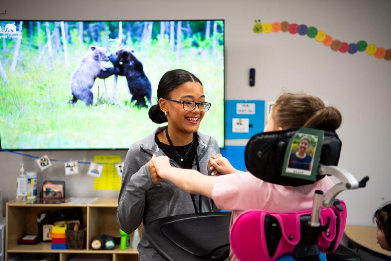 MSU student working with a child in a wheelchair