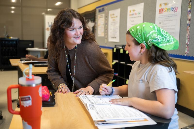 MSU student working with youth in a classroom